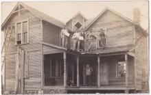 George Decker on porch on new home built by J B Denune